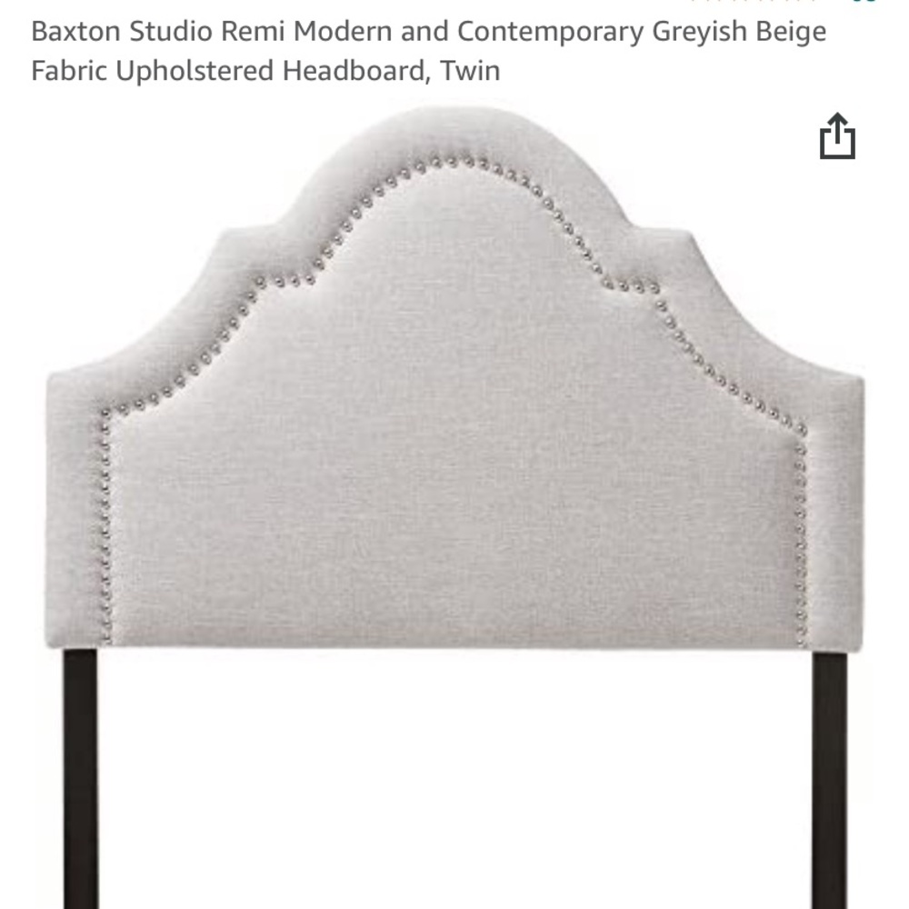 Twin greyish beige fabric upholstered headboard.